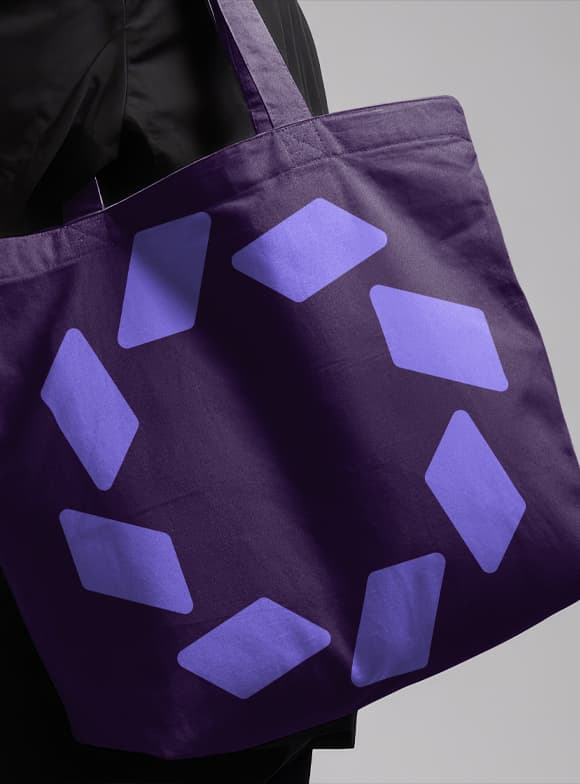 Branded tote bag with a purple geometric pattern